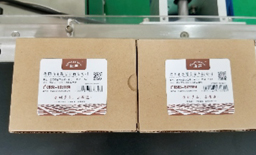 Assembly line labeling head